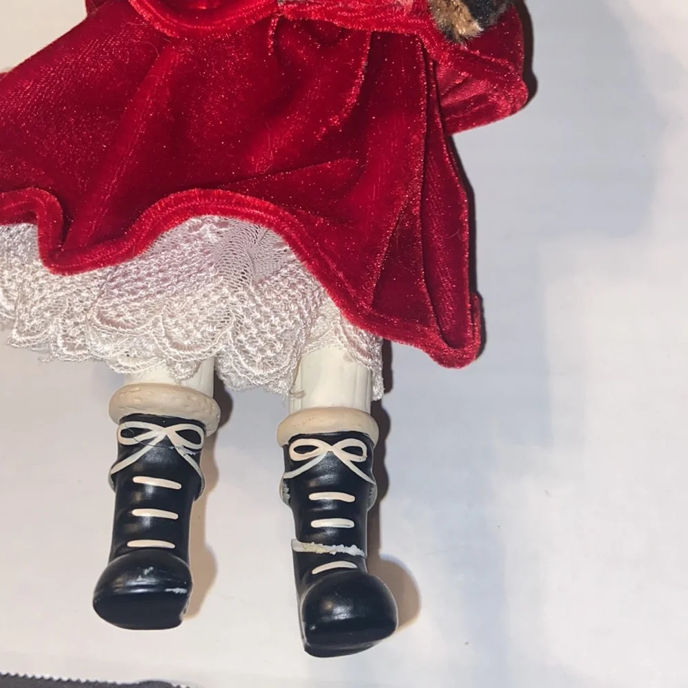 Vintage African American doll ornament with red velvet and leopard fur purse